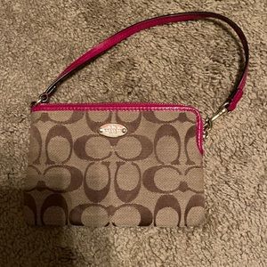 Coach pink and tan wristlet